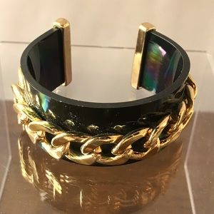 Black bangle with gold chain details